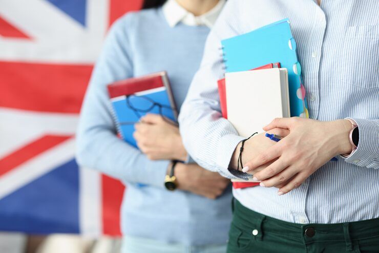 two-students-hold-notebooks-against-background-flag-england-learning-english-concept_151013-18193.jpg_uid=R63806068&ga=GA1.1.1411269396.1753471703&semt=ais_hybrid&w=740&q=80.png